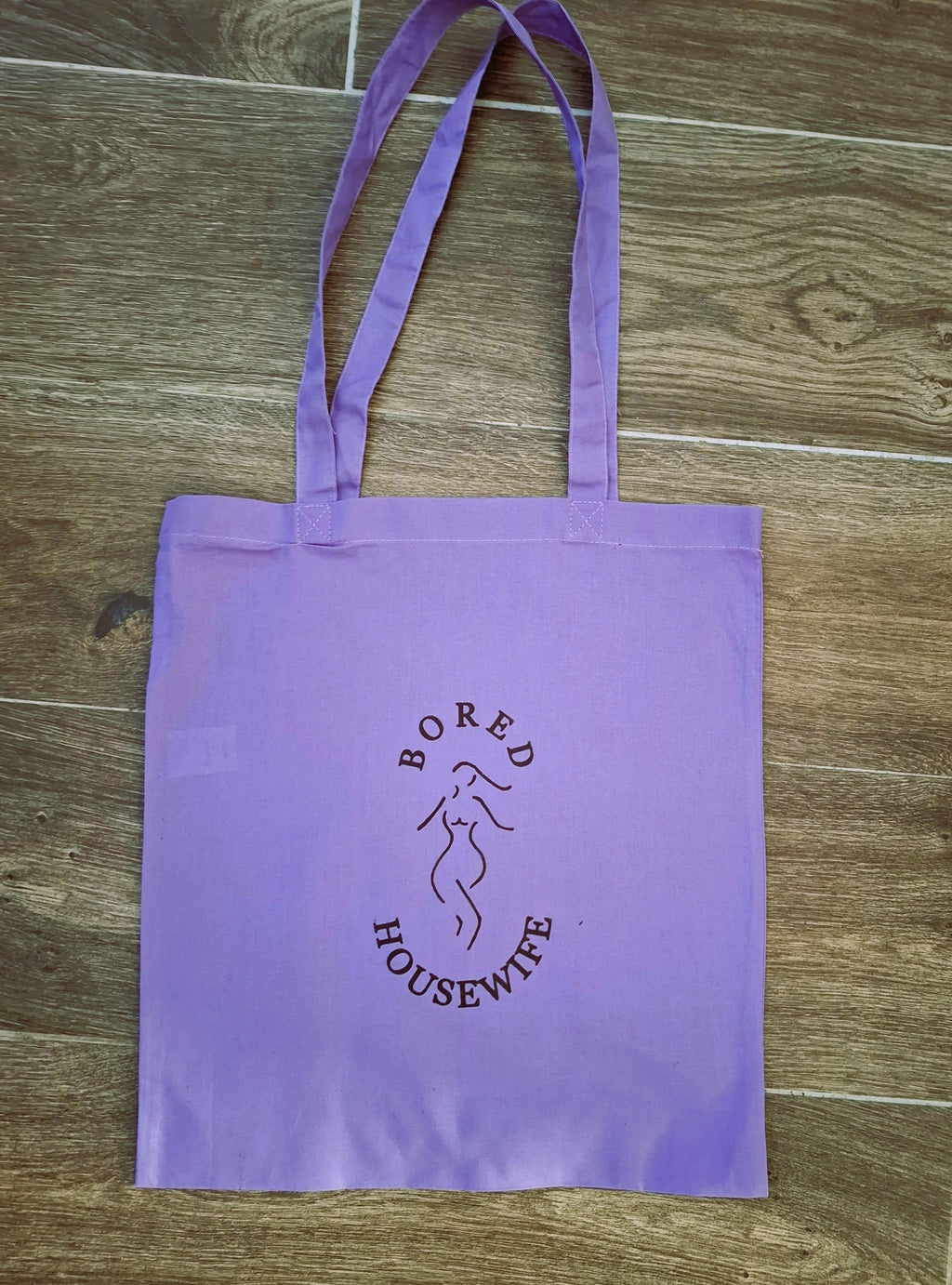 Bored Housewife Tote bags