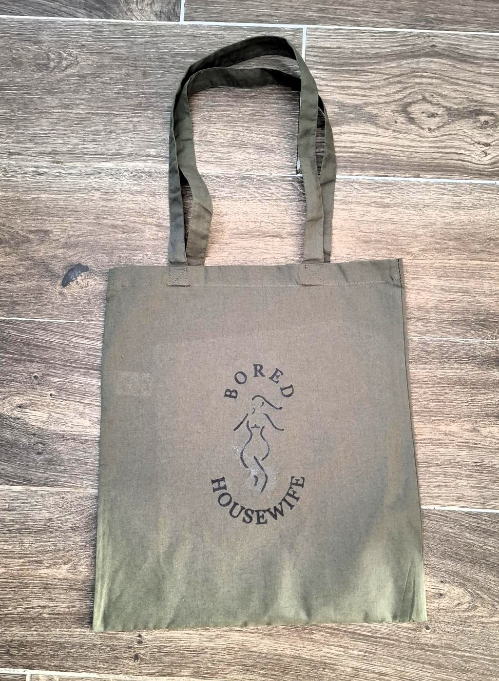 Bored Housewife Tote bags