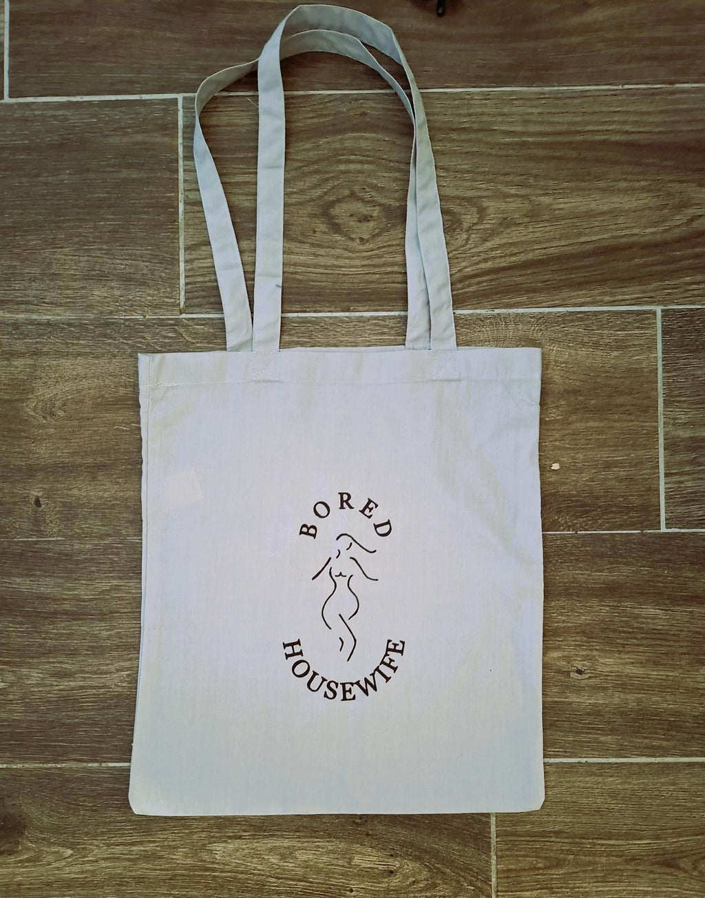 Bored Housewife Tote bags