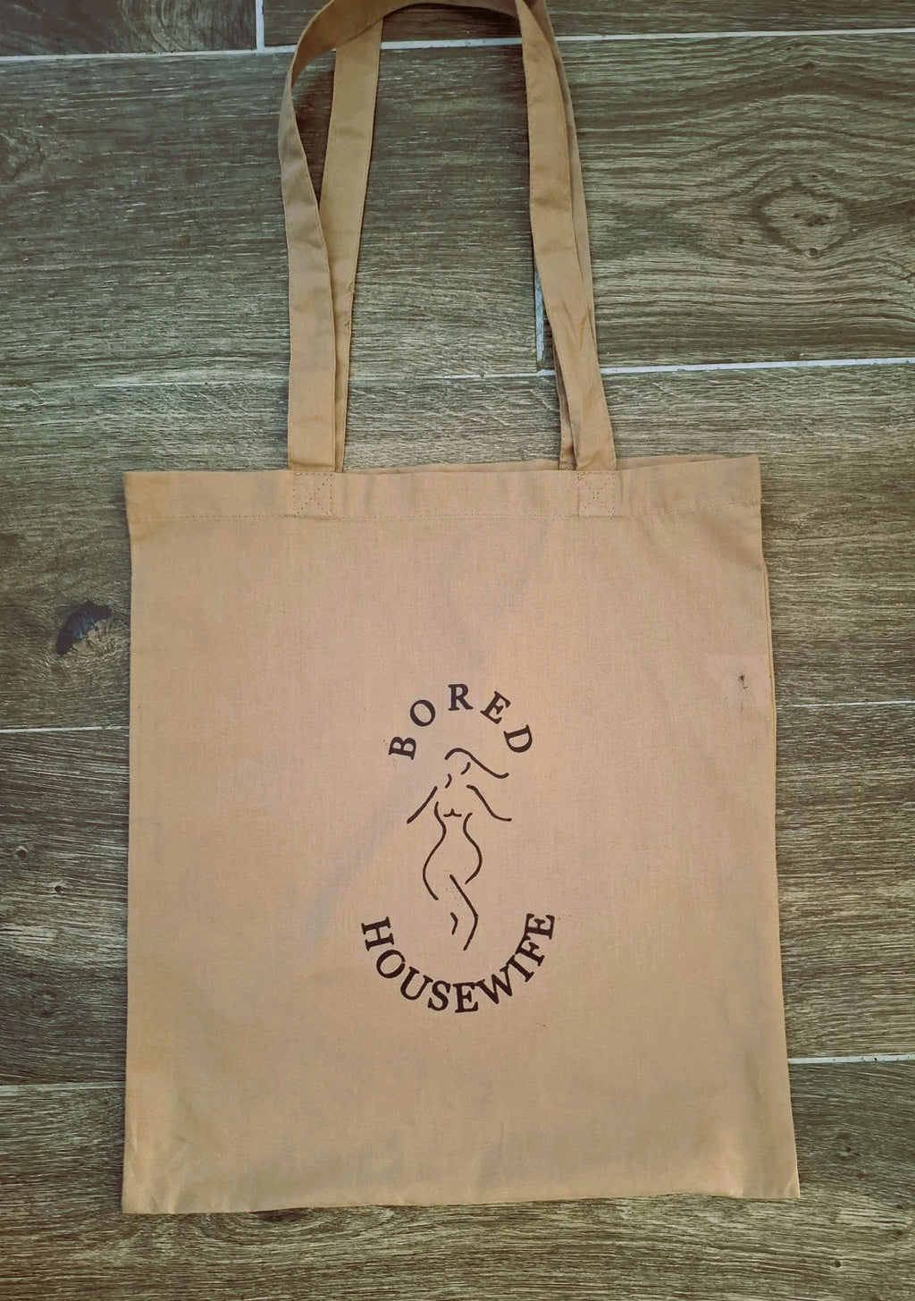 Bored Housewife Tote bags
